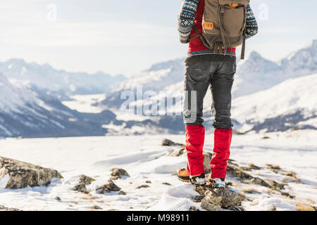 Switzerland, Engadin, lowsection of hiker standing in mountainscape Stock Photo