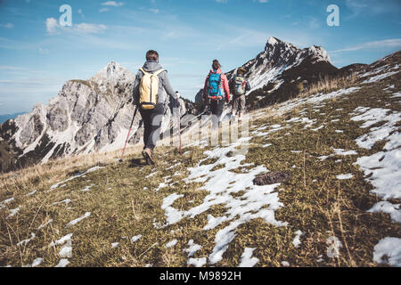 Austria, Tyrol, three hikers walking in the mountains Stock Photo
