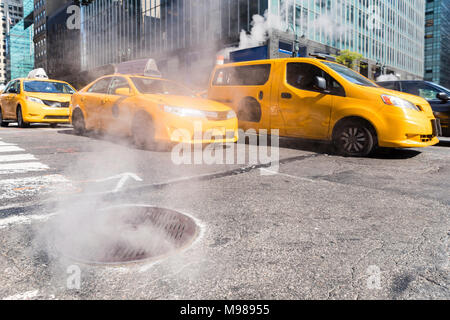 USA, New York, steam coming out from sewer Stock Photo
