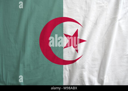 Closeup of Algeria national flag background, with fabric texture. Stock Photo