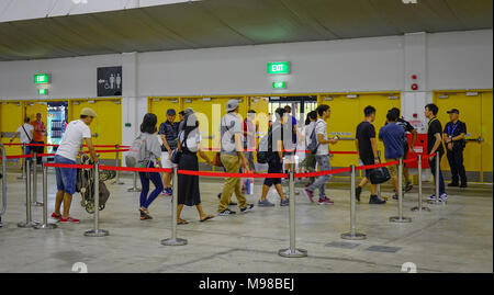 Singapore - Feb 11, 2018. People waiting at bus station to Changi Airbase in Singapore. Stock Photo