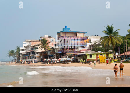 A view of the beach in Hikkaduwa with blue sky on a sunny day. Stock Photo
