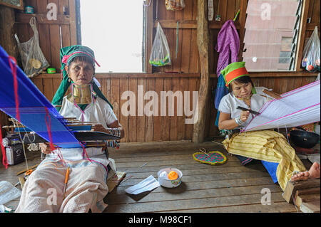 Long necked Karen women weaving cloth, Inle Lake Myanmar