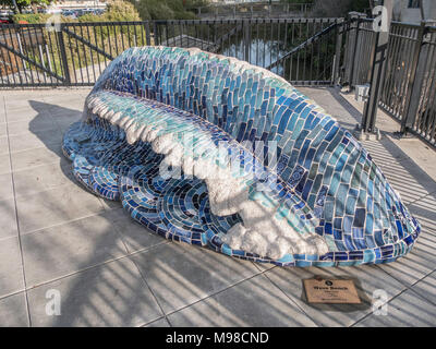 City of Napa, California / November 28, 2016: Wave Bench by Peter Hazel is a ceramic and glass mosaic on cement sculpture. Stock Photo