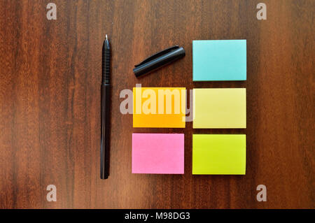 Colorful sticky notes and a on wood table Stock Photo