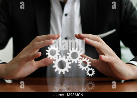 Integrated processes - hands protecting process chain Stock Photo - Alamy