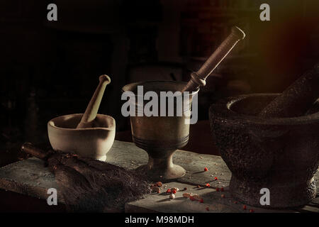 Mortar And  Pestle .Three mortar and pestle isolated in a dark goth like effect . Isolated. Stock Photo Stock Photo