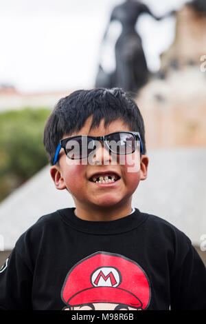 LA PAZ, BOLIVIA - JANUARY 12, 2018: Unidentified boy at street of La Paz, Bolivia. At an elevation of 3650 m La Paz is the highest capital city in the Stock Photo