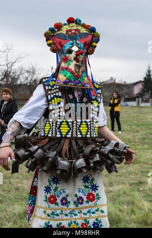 MEDOVO, BULGARIA - MARCH 17, 2018: People in traditional carnival masquerade costumes at Kukeri Festival, Medovo village near Burgas, Bulgaria. Stock Photo