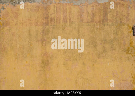 vintage wall background - old wall plaster texture, yellow, brown Stock Photo