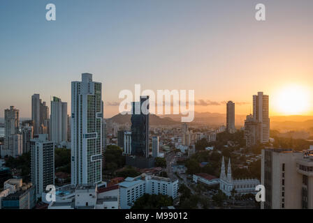 sunset sky over modern city skyline from high viewpoint  - Stock Photo