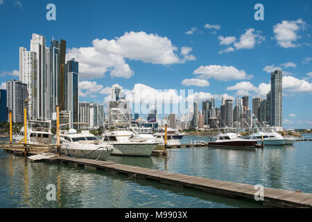 luxury yacht boats on harbor in Panama City with business district skyline - Stock Photo