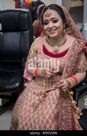 A pretty young bride before her wedding at the Sikh Cultural Center in Richmond Hill, Queens New York. Stock Photo