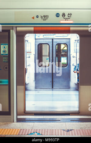 SEOUL, SOUTH KOREA - AUGUST 16, 2015: Automatic doors to subway train being open at Yongsan station - main railway station in Seoul, South Korea Stock Photo