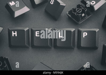 Word Help Written with Computer Keyboard Keys. Concept Image. Close up. Stock Photo
