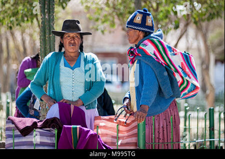 Unidentified indigenous native Quechua people in traditional clothing at the local Tarabuco Sunday Market, Bolivia - South America Stock Photo