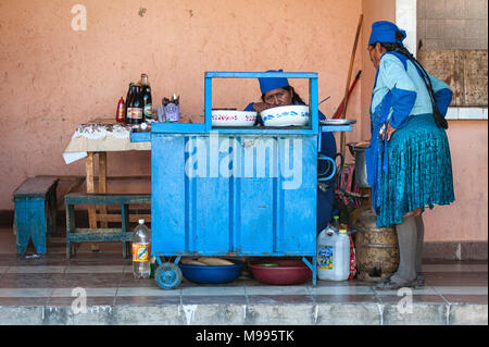 Unidentified indigenous native Quechua people in traditional clothing at the local Tarabuco Sunday Market, Bolivia - South America Stock Photo