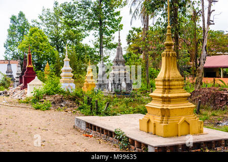 Stupa, traditional Buddhist burial gravestones at a temple in a rural area of Cambodia Stock Photo