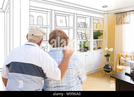 Senior Couple Facing Custom Built-in Shelves and Cabinets Design Drawing Gradating to Finished Photo. Stock Photo