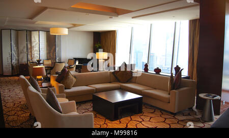 SINGAPORE - APR 2nd 2015: Beautiful living room interior with View in a luxury hotel room of the Marina Bay Sands Resort Stock Photo