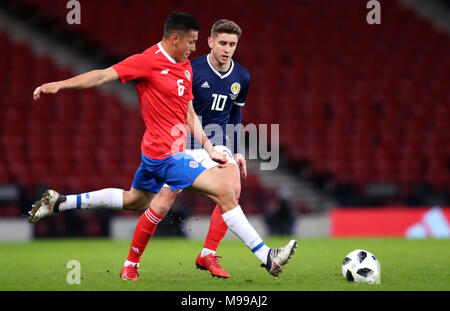 Scotland's Tom Cairney (right) and Costa Rica's Oscar Duarte battle for the ball during the international friendly match at Hampden Park, Glasgow. PRESS ASSOCIATION Photo. Picture date: Friday March 23, 2018. See PA story SOCCER Scotland. Photo credit should read: Jane Barlow/PA Wire. RESTRICTIONS: Use subject to restrictions. Editorial use only. Commercial use only with prior written consent of the Scottish FA. Stock Photo