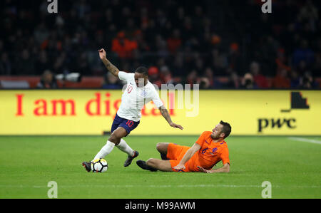 Netherlands' Stefan de Vrij (right) challenges England's Raheem Sterling during the international friendly match at the Amsterdam ArenA. Stock Photo