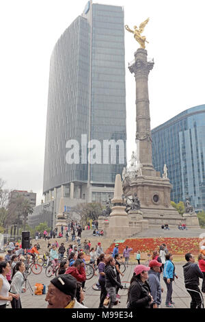 The Angel of Indepdendence stands above a Sunday crowd of residents below when the usually traffic-clogged roundabout becomes pedestrian only Stock Photo