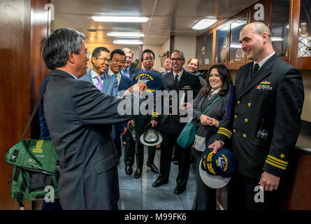 NORFOLK (Feb. 21, 2018) Ambassador of the Socialist Republic of Vietnam to the United States Pham Quang Vinh admires his command ball cap during a visit aboard the aircraft carrier USS George H. W. Bush (CVN 77). Vinh visited the ship to promote continued interoperability and a strong relationship between Vietnam and the U.S. The ship is in port in Norfolk, Va., conducting routine maintenance in preparation for the Board of Inspection and Survey (INSURV). (U.S. Navy Stock Photo