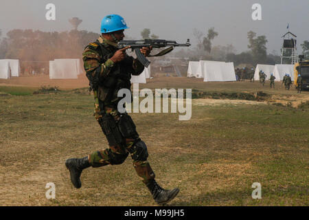 A Bangladesh Army soldier of the Para-Commando Brigade runs to secure a drop zone during a rehearsal for a demonstration as part of Exercise Shanti Doot 4 in Bangladesh. Shanti Doot 4 is a multinational United Nations peacekeeping exercise with more than 1,000 participants from more than 30 countries designed to provide pre-deployment training to U.N. partner countries in preparation for real-world peacekeeping operations. (U.S. Marine Corps Stock Photo