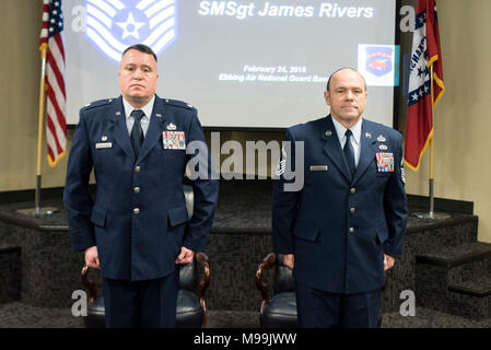 Lt. Col Gregory Johnson, Commander of the 288th Operations Support Squadron (left) and James W. Rivers, 123rd Intelligence Squadron Superintendent (right) stand at attention for the national anthem at Rivers’ Chief Mater Sgt. promotion at Ebbing Air National Guard Base, Fort Smith, Ark., Feb. 24, 2018.  Rivers enlisted in the Air Force in July, 1986, and has served vital roles in the intelligence community in both Active Duty and the Air National Guard.  (U.S. Air National Guard Stock Photo