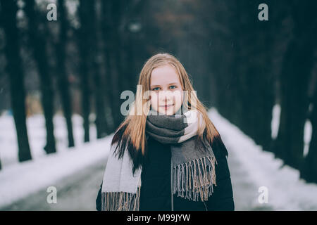 Smiling blonde teen girl 14-16 year old wearing stylish clothes posing  outdoors. Looking at camera. Autumn season Stock Photo - Alamy