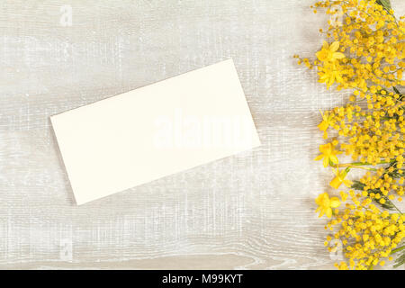 Spring holiday composition in yellow colors. Yellow orange flowers concept, top view, copy space, in yellow tones on a wooden surface Stock Photo