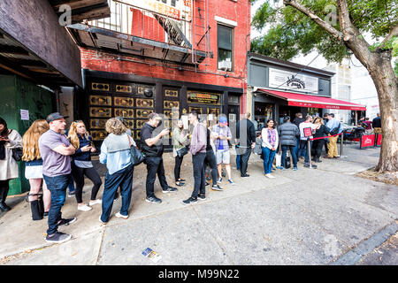Brooklyn, USA - October 28, 2017: Long line queue of people crowd waiting for famous restaurant food called Juliana's Pizza Stock Photo