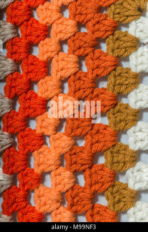a handmade crochet fabric of different colors Stock Photo
