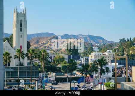 Los Angeles, JUN 23: Hollywood United Methodist Church and Hollywood sign in the famous Hollywood area on JUN 23, 2017 at Los Angeles, California Stock Photo