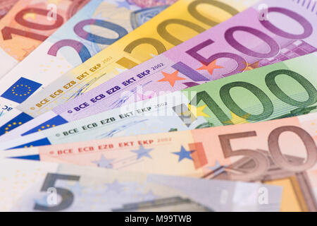 group of many Euro banknotes laying on table Stock Photo