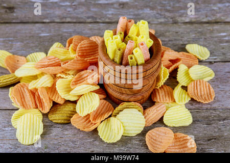 corn chips with spices in wood bag on wooden background Stock Photo