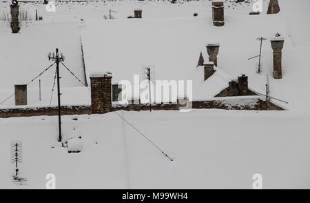 Chimneys And Roofs Beneath Snow Stock Photo