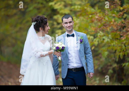 Belarus, Gomel, 7 October 2017. Wedding day.The bride and groom on a wedding walk in nature.Wedding trip. Stock Photo