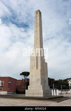 Rome. Italy. Obelisk at the entrance to the Foro Italico, bearing the insciption 'Mussolini Dux'.  The monument was created after an offer of a giant  Stock Photo