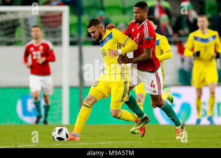 Kenneth Otigba of Ferencvarosi TC tackles Marko Futacs of MOL