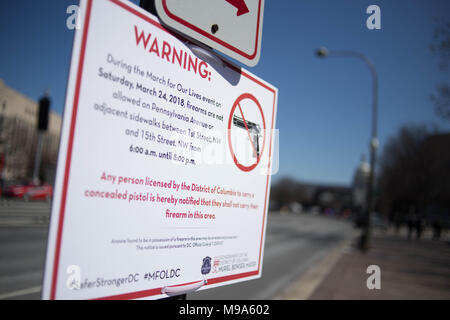 Washington, USA. 23rd March, 2018. A sign prohibiting firearms is seen in Washington, D.C. ahead of the student-led March For Our Lives, Friday, March 23, 2018. Credit: Michael Candelori/Alamy Live News Stock Photo