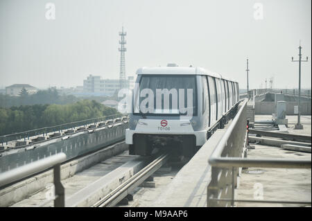 Shanghai. 23rd Mar, 2018. Photo taken on March 23, 2018 shows a subway train running on the first APM line, or the Automated People Mover system, in Shanghai, east China. A new metro line with driverless trains is expected to be tested by the end of March in Shanghai, the Shanghai Shentong Metro Group announced on Friday. Credit: Ding Ting/Xinhua/Alamy Live News Stock Photo