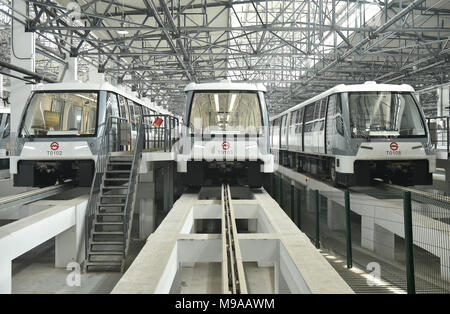 Shanghai. 23rd Mar, 2018. Photo taken on March 23, 2018 shows subway trains for the first APM line, or the Automated People Mover system, park at a garage in Shanghai, east China. A new metro line with driverless trains is expected to be tested by the end of March in Shanghai, the Shanghai Shentong Metro Group announced on Friday. Credit: Ding Ting/Xinhua/Alamy Live News Stock Photo