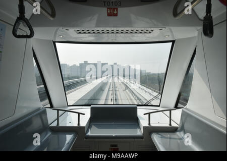 Shanghai. 23rd Mar, 2018. Photo taken on March 23, 2018 shows a subway train running on the first APM line, or the Automated People Mover system, in Shanghai, east China. A new metro line with driverless trains is expected to be tested by the end of March in Shanghai, the Shanghai Shentong Metro Group announced on Friday. Credit: Ding Ting/Xinhua/Alamy Live News Stock Photo