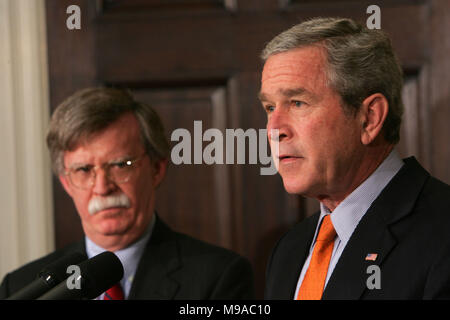 FILED - Washington, DC - August 1, 2005 -- United States President George W. Bush announces the recess appointment of John Bolton to be the United States Ambassador to the United Nations in the Roosevelt Room of the White House on August 1, 2005. left to right: John Bolton, President George W. Bush. Credit: Dennis Brack - Pool via CNP - NO WIRE SERVICE · Photo: Dennis Brack/Consolidated News Photos/Dennis Brack - Pool Stock Photo