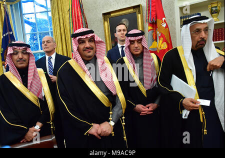 Washington, USA. 20th Mar, 2018. White House Chief of Staff John Kelly (2nd-L) and White House Advisor Jared Kushner (3rd-R), stand alongside members of the Saudi Delegation as they attend a meeting with President Donald Trump and Crown Prince Mohammed bin Salman of the Kingdom of Saudi Arabia in the Oval Office at the White House on March 20, 2018 in Washington, DC Credit: Kevin Dietsch/Pool via CNP - NO WIRE SERVICE · Credit: Kevin Dietsch/Consolidated News Photos/Kevin Dietsch - Pool via CNP/dpa/Alamy Live News Stock Photo