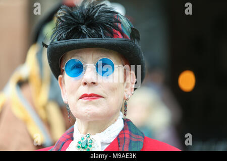Lady wearing steampunk style clothes and blue tinted sunglasses. Steampunk is a style of fashion that combines historical elements and anachronistic technology, often inspired by Edwardian science fiction. Peter Lopeman/Alamy Live News Stock Photo