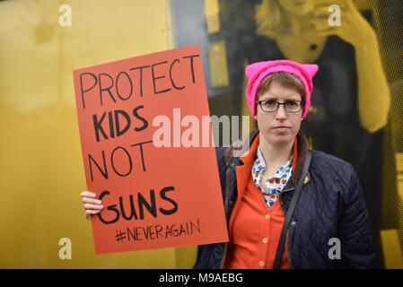 Nine Elms Lane, US embassy, London, UK. 24th March 2018. Protesting for gun control outside the US embassy in Nine Elms Lane, London after the Parkland school shooting in Florida. Credit: Matthew Chattle/Alamy Live News