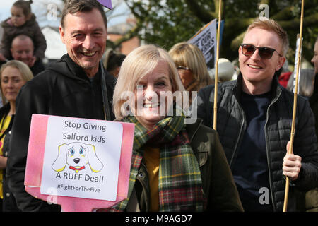 Salford, UK. 24th March, 2018. A women holding a sign which reads 'Stop giving Salford Kids A Ruff Deal', Swinton, Salford, 24th March, 2018 (C)Barbara Cook/Alamy Live News Stock Photo